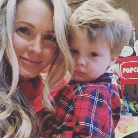 Shandi Finnessey and her son with a lumberjack shirt on.