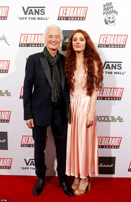 Scarlett Sabet wearing a pink silk gown and Jimmy Page in a tuxedo at the red carpets.