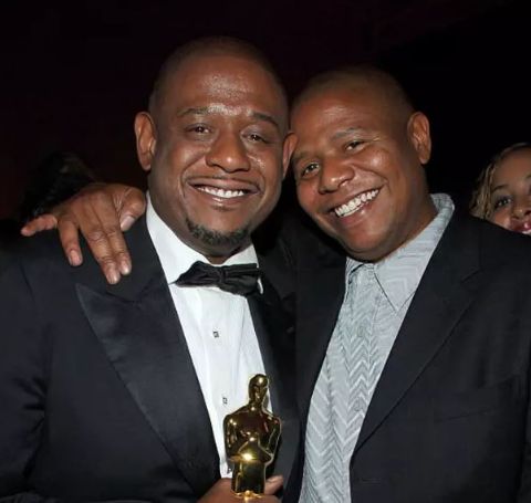 Kenn Whitaker with brother Forest Whitaker and his award.