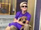 Jacqueline Toboni in a purple t-shirt with dog.