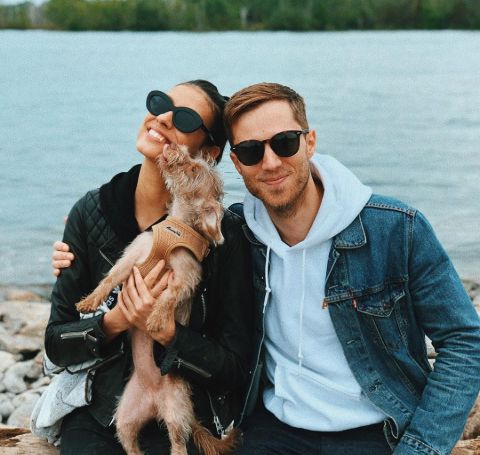 Laysla De Oliviera in black t-shirt and goggles with boyfriend Jonathan Keltz and dog. 