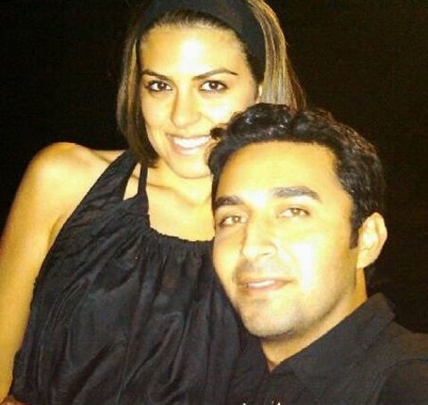 Pej Vahdat in black shirt with girlfriend. 