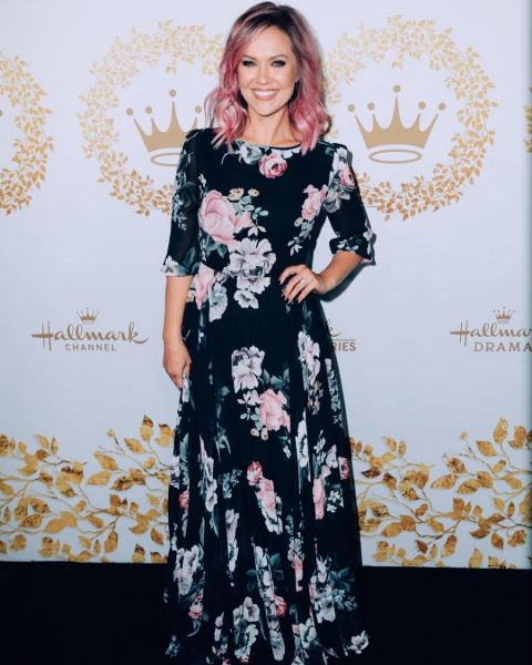 Emilie Ullerup in pink hair, and a gorgeous black dress.