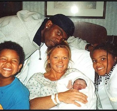 Libby Offutt with her new born baby in hand and her ex-husband Randy Moss.