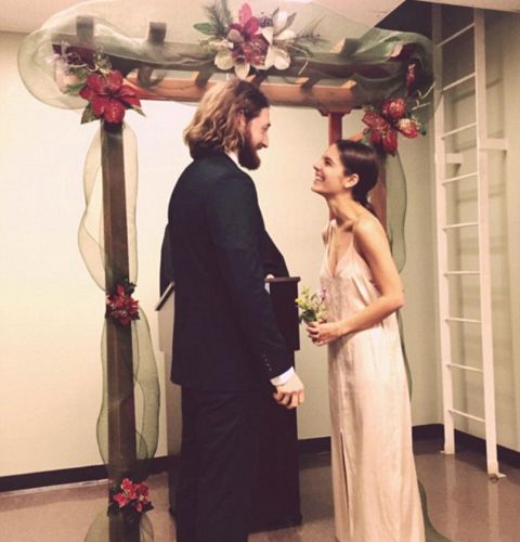 Actress,Caitlin Stasey standing along with her husband, Lucas Neff at the time of their wedding.