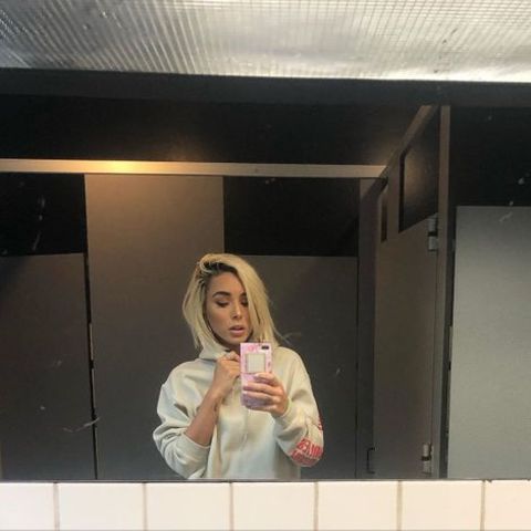 Tiffany Bondoc clicking a mirror selfie.