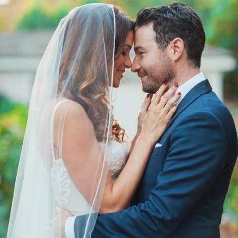 Courtney Henggeler and her husband, Ross at their wedding ceremony.