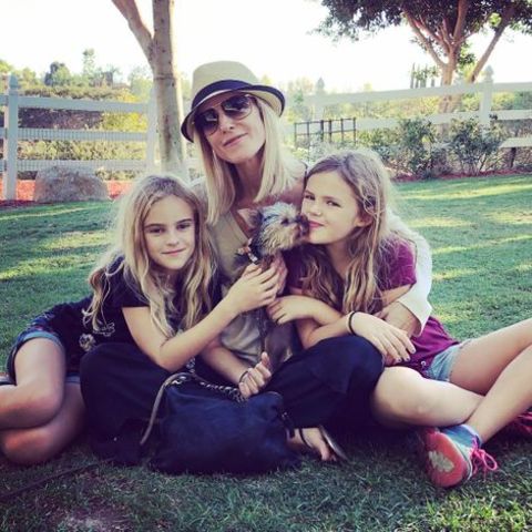Actress, Tricia O'Kelley posing along with her daughters from married life with former husband and dog.