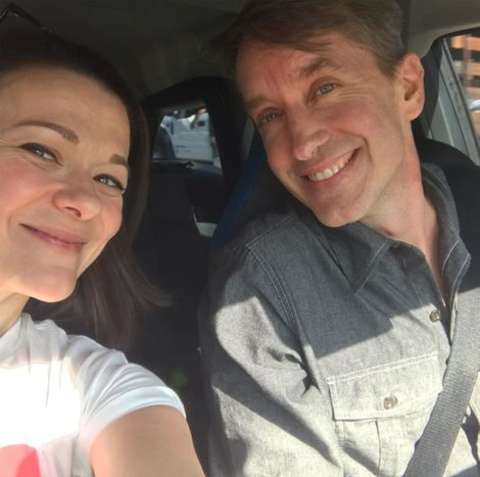 Actress, Maribeth Monroe taking a selfie with her husband Andy in the car.