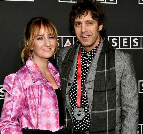 Jeremy Ivey in grey coat and  black muffler with wife Margo Price.