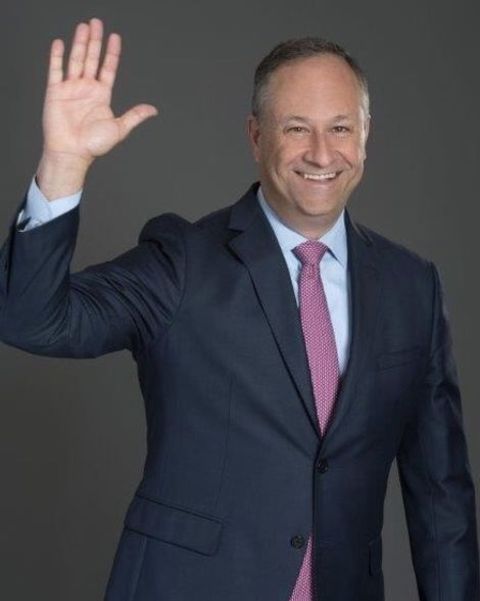 Lawyer, Douglas Emhoff waving a hand while giving a pose.