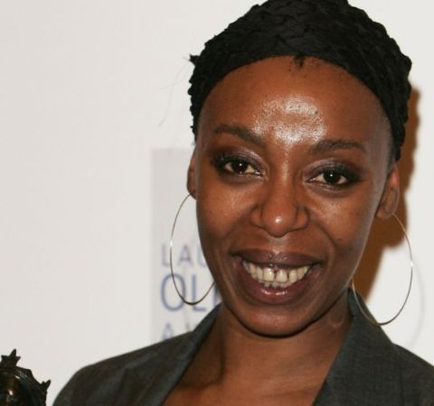 Noma Dumezweni in a black dress at an event.