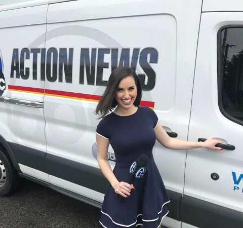 Katie Katro poses in front of ABC Action News's van.