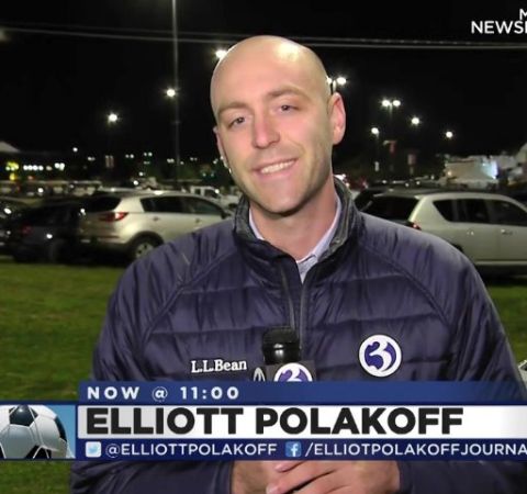 Elliott Polakoff in a black jacket reporting for Channel 3.