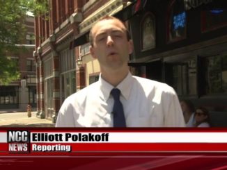 ESPN reporter Elliott Polakoff in a white shirt while reporting a news.