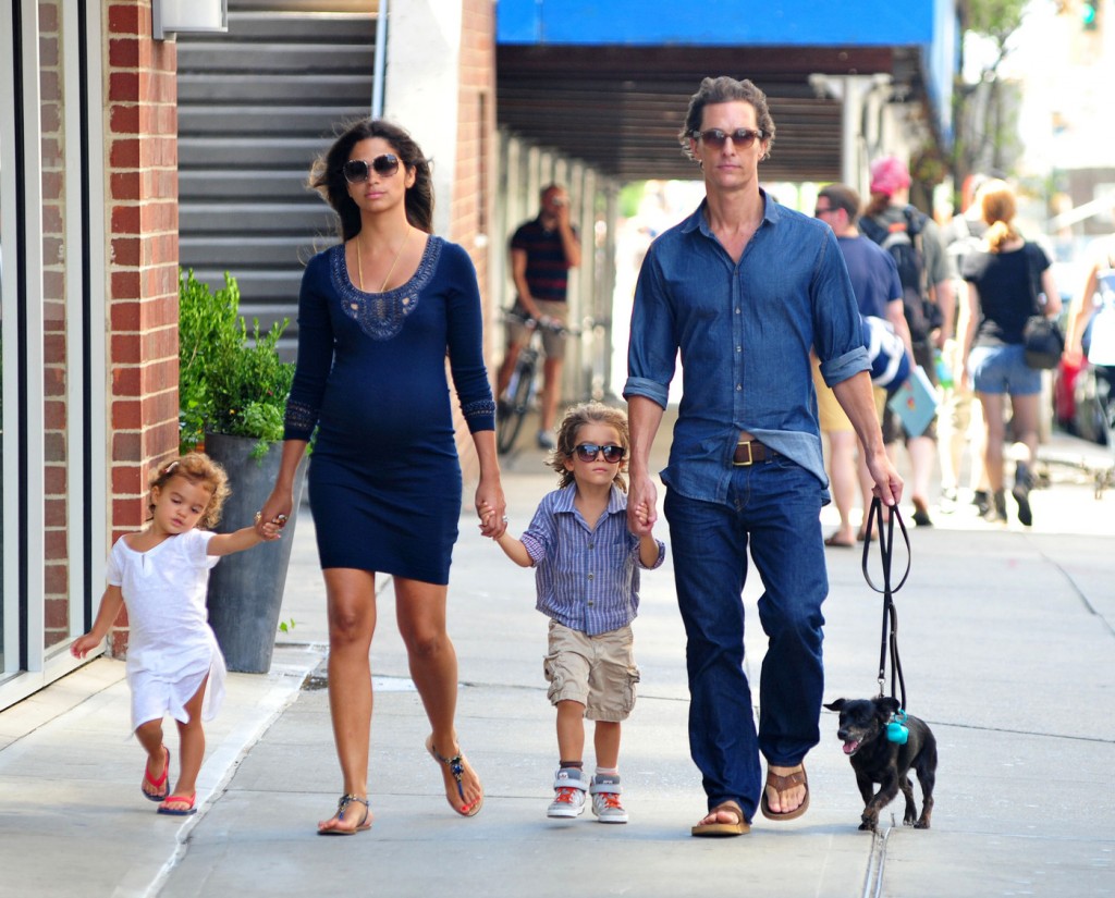 Matthew McConaughey holds hands with son Levi, pregnant wife Camila Alves, and daughter Vida as they walk their dog around New York City