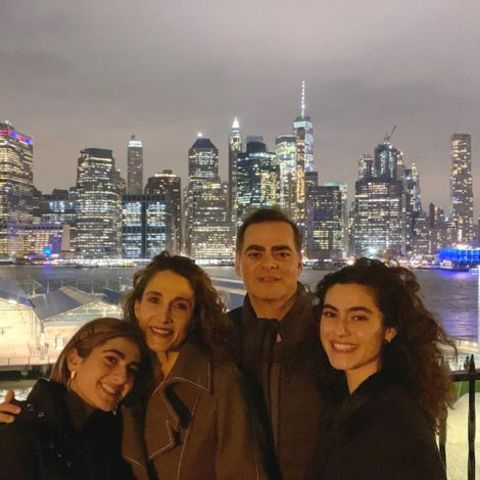 Melina Kanakaredes giving a pose with her husband, Peter and daughters, Zoe and Karina.