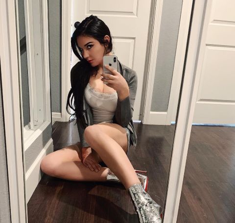 Kristina Basham in her house poses for a mirror selfie.