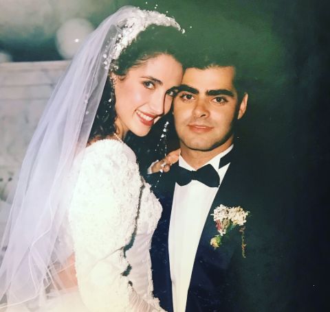 Peter Constantinides with his Melina Kanakaredes in their wedding.