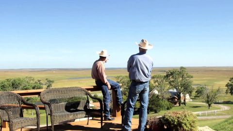 Ladd drummond owns 433,000 acres of ranch in Pawhuska,Oklahoma making him worth $200 million.