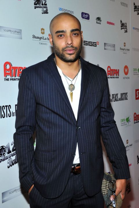 Rainbow Sun Francks giving a pose in an event.