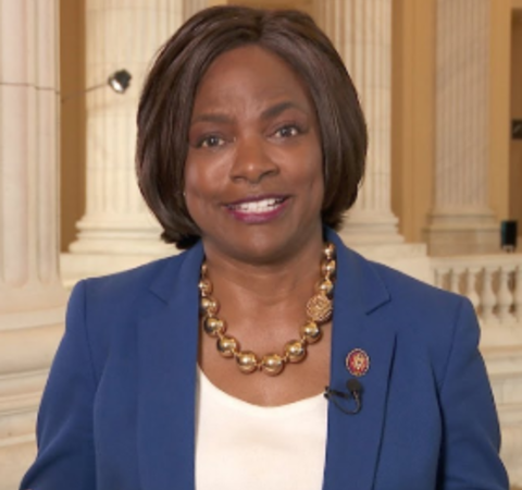Val Demings in a blue coat poses for a picture.