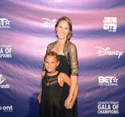 Leah Bernthal poses with her daughter at an event.