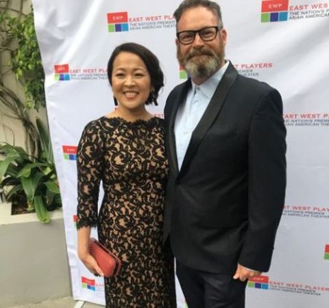 Suzy Nakamura  and her husband Harry Hannigan pose for a picture.