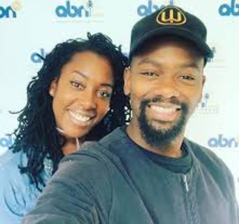 David Ajala in a black t-shirt clicks a selfie with wife Terri Martin.