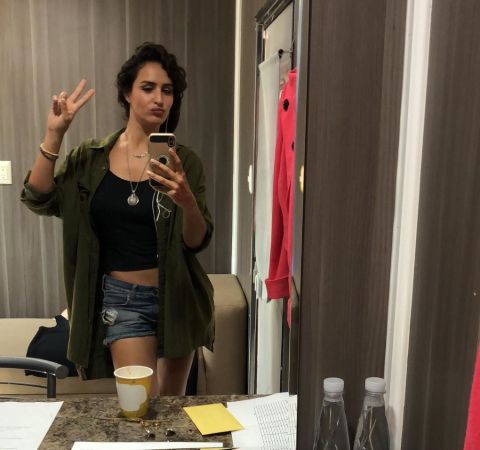 Fernanda Urrejola in a black top poses for a mirror selfie for her Instagram.