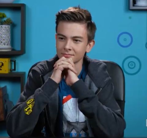 Jaxon React in a black jacket poses during reacting. 