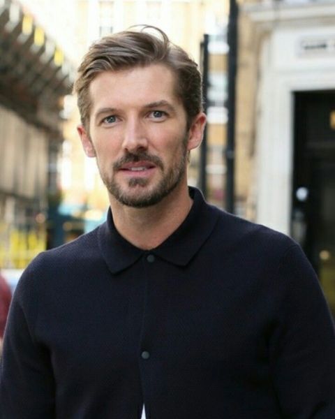 Gwilym Lee giving a pose during a photoshoot.
