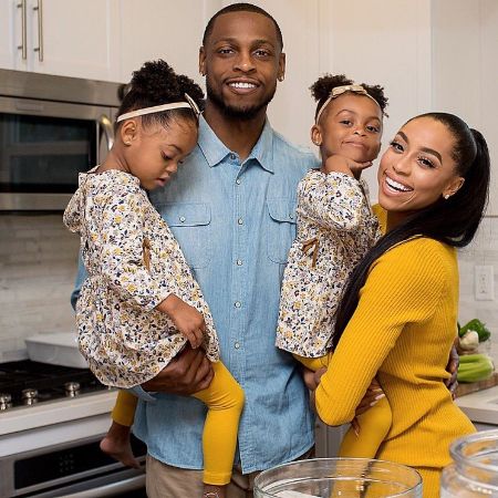 Autumn with her husband, Seyi Ajirotutu, and their twins' daughter