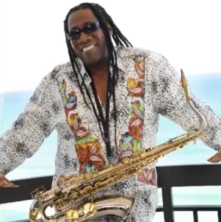 The late legend Clarence Clemons smiling at the camera