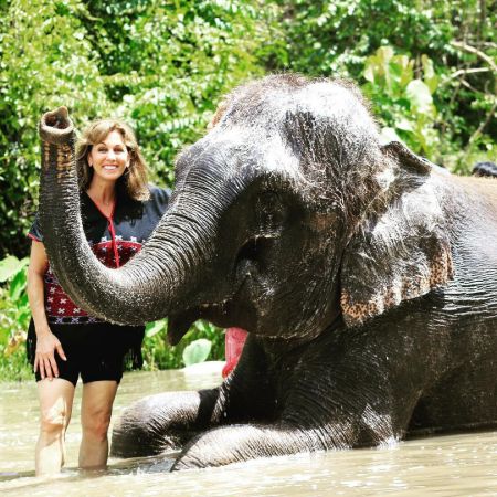  Janet Shamlian bathing an elephant and enjoying her vacation in Thailand. 
